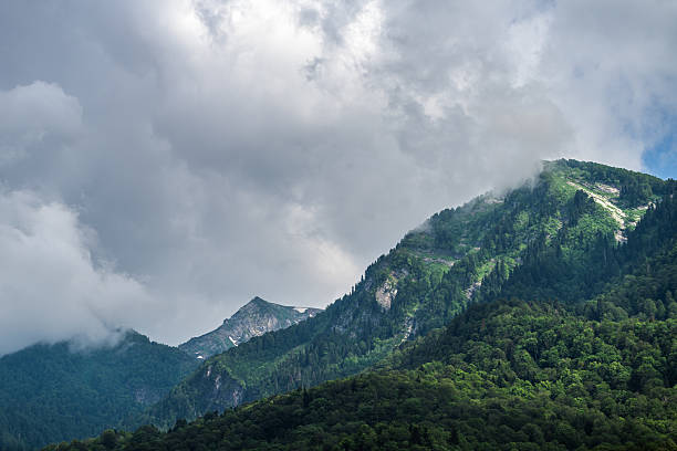 Beautiful Caucasus mountains under dramatic overcast sky
