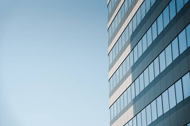 istock New building architecture on blue sky background,Low angle architectural exterior view of modern,copy space for text 2220621340