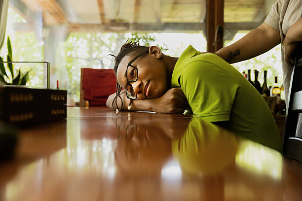 Portrait of a cute teenager with a ball tired after playing football