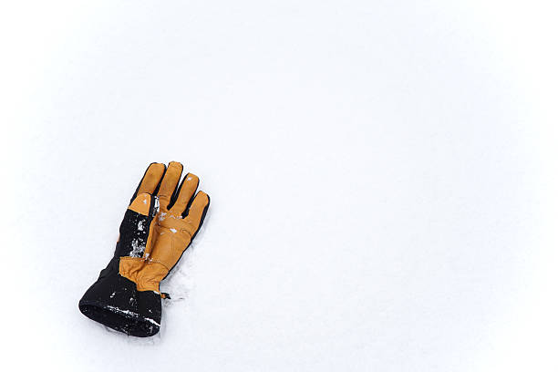 glove on the ground after snow