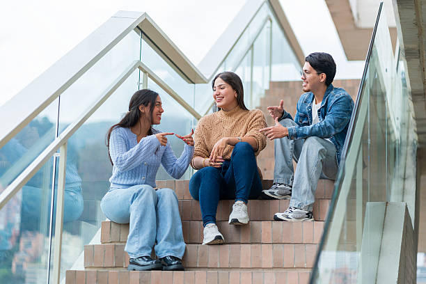 istock Young coworkers having a friendly conversation on outdoor stairs 2220624982