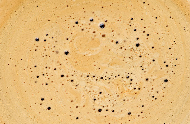istock Coffee drink background. Cappuccino creamy milk foam texture. Top view on white background. Design element. 2220627256