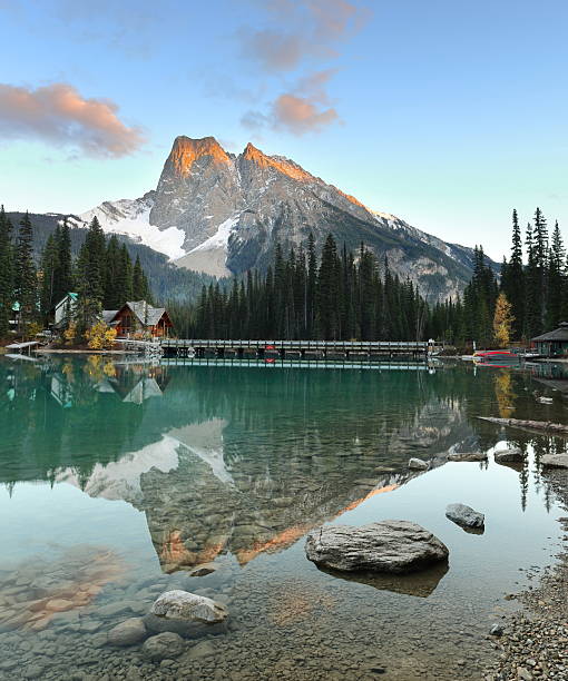 istock Metallic reflection in Emerald Lake southwest end at evening, the Emerald Lodge peninsula bridge and Burgess and Walcott Peaks. Yoho NP-BC-Canada-359 2220628444