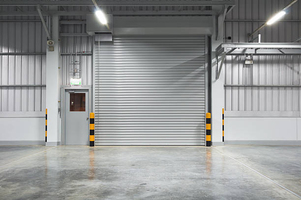 istock Concrete floor and shutter door suit for product display background. 2220634654