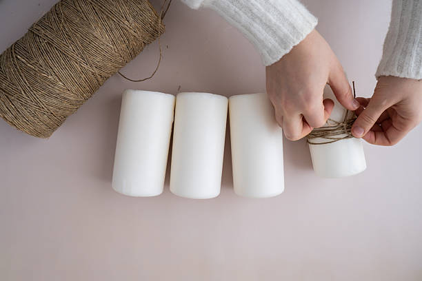 istock Step by step instruction of making handmade Christmas advent four weeks candle calendar. Female hands creating craft homemade decor. New year celebration. Winter holidays 2220636953