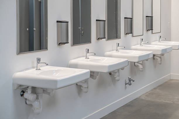 istock interior of public restroom with sinks in a row 2220638466