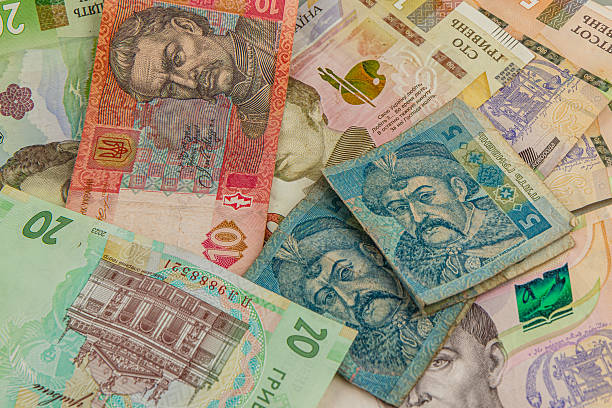 istock Ukrainian currency gathered on a textured surface 2220638857