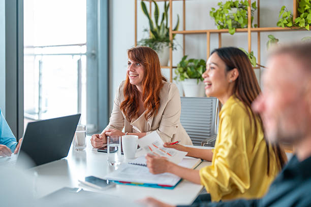 istock Confident Businesswoman Leads Multicultural Team Discussion 2220641220