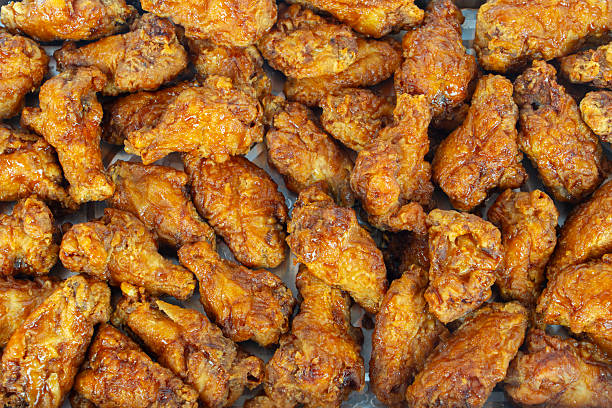 istock high angle view of fried chicken wing as background 2220642017