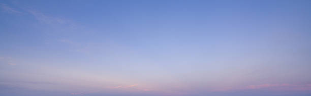 Twilight sky with soft pastel colors and gentle clouds during evening. Tranquil atmospheric background perfect for wellness marketing and meditation themed relaxation content. Mindfulness themes.
