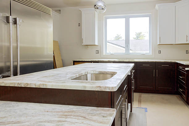istock Modern kitchen renovation with sleek cabinets marble countertops in bright natural light 2220647737