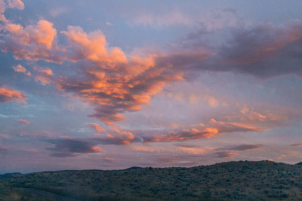 istock Vibrant sunset clouds over rolling hills in Lac Du Bois Grasslands 2220649366