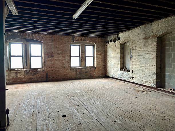istock Empty industrial loft with exposed brick, wooden floors, windows 2220649541