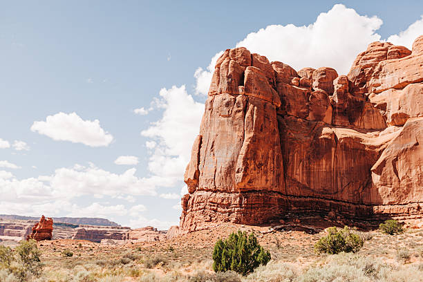 istock Red Rock Cliffs on bright, hot day in Arches National Park 2220650017