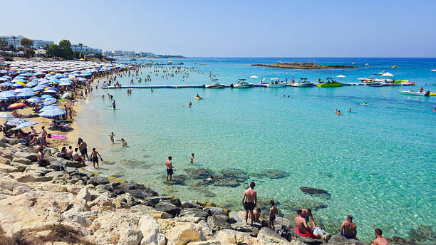 PROTARAS, CYPRUS , June 8 2025: Tourists at Fig Tree bay beach relaxing and enjoying their summer holidays at Protaras Cyprus.