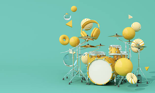 Bright yellow drum set with floating headphones and abstract 3D shapes on mint background, perfect for modern music themes and promotional designs. 3d rendering.