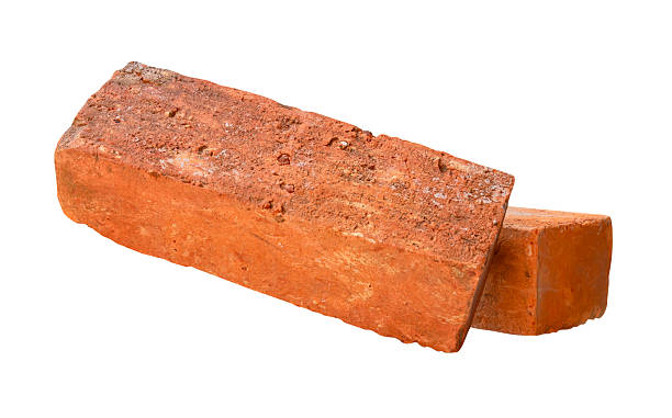 istock Side view of two cracked old red or orange bricks in stack isolated on white background with clipping path 2220658257
