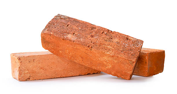 istock Side view of three cracked old red or orange bricks in stack isolated on white background with clipping path 2220658754