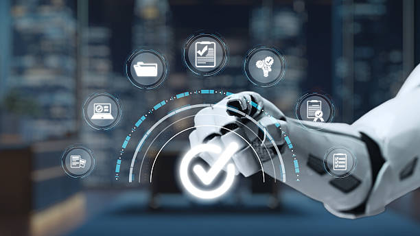 istock Robotic Arm Interacting with Digital Icons Representing Progress, Technology, and Automation in a Modern Workspace Setting. Auvana 2220660323