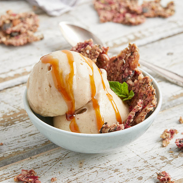 istock Banana nice cream scoops with caramel sauce and biscuit 2220660326