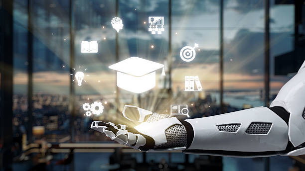 istock Futuristic Robot Hand Holding Digital Icons Representing Education, Innovation, Technology, and Progress in a Modern Office Environment. Auvana 2220660361