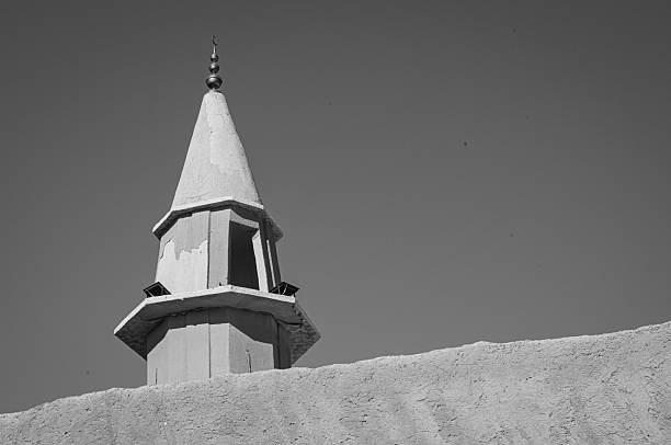 White old minaret of mosque in Arabic city in Cairo, Egypt