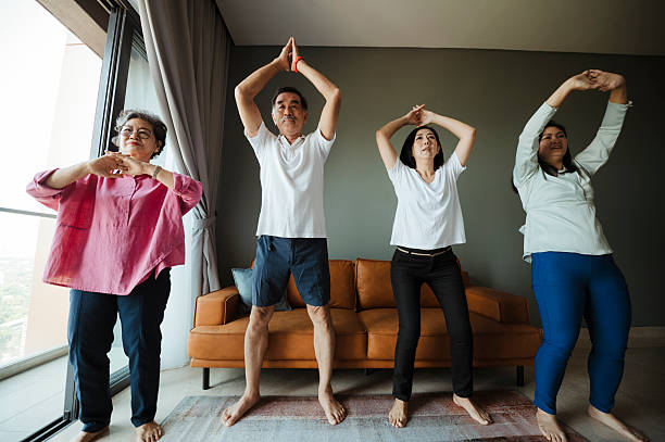 istock Together in Health: Family Engaging in Light Exercise Indoors 2220661977