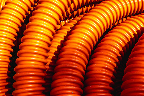 istock Bright orange industrial cable coils in sunlight 2220665839