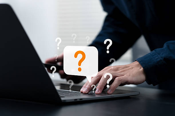 istock Businessman hand pointing question mark sign for QA, Question and Answer. FAQ, frequently asked questions. copy space. Instructions and rules. Information, Communication Concepts on digital platform. 2220668576