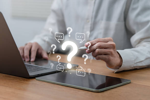 istock Man hand pointing question mark sign for QA, Question and Answer. FAQ, frequently asked questions. copy space. Instructions and rules. Information, Communication Concepts on digital platform. 2220668609