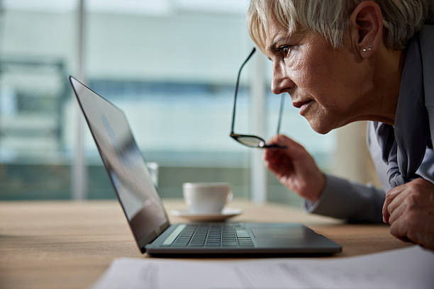 istock Senior businesswoman staring at a computer in the office. 2220670170