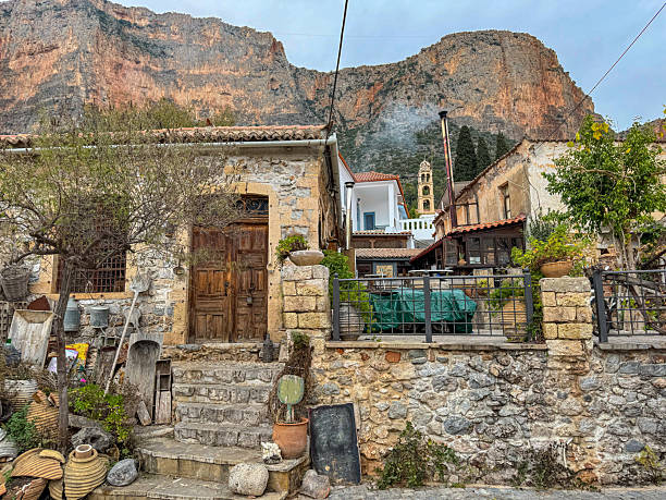 istock Old and rustic stone homes with terracotta roofs line narrow paths of Leonidio 2220671096