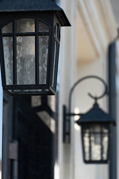 istock Vintage Wall-Mounted Lanterns on Building Exterior 2220676601