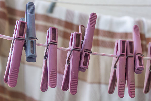 clothespins hanging on a rope, washing clothes, drying clothes, clothespins for drying