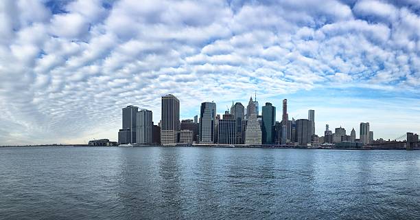 istock Manhattan skyline under a blue winter sky with patchy clouds, New York, USA, January 2019 2220680389