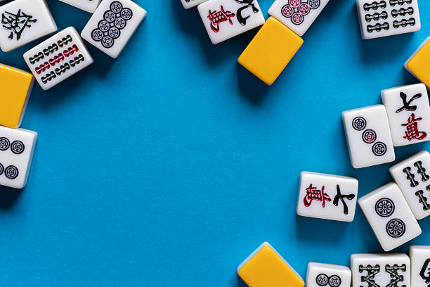 istock Mahjong tiles lined up on a blue background 2220680629