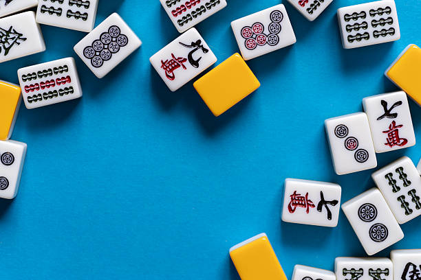 istock Mahjong tiles lined up on a blue background 2220680649