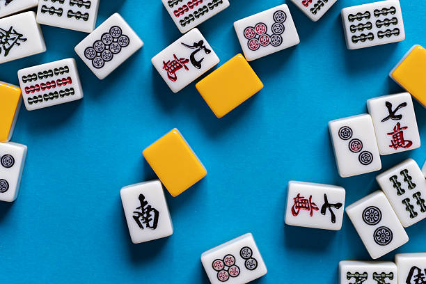istock Mahjong tiles lined up on a blue background 2220680683