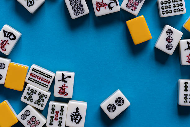 istock Mahjong tiles lined up on a blue background 2220680696