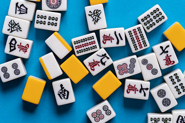 istock Mahjong tiles lined up on a blue background 2220680709