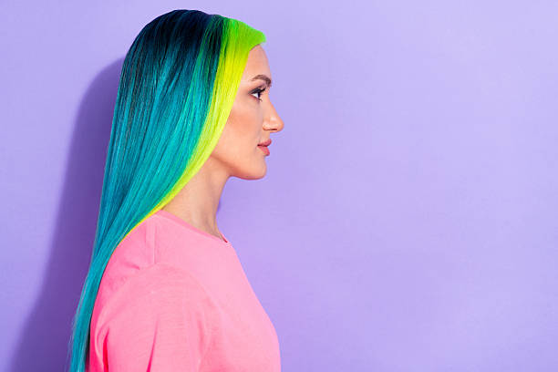 istock Profile side photo of millennial blue teal different color haired lady look empty space isolated over violet color background 2220683877