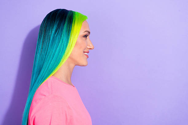 istock Profile side photo of teal blue multicolored haired lady look empty space isolated over purple color background 2220684066