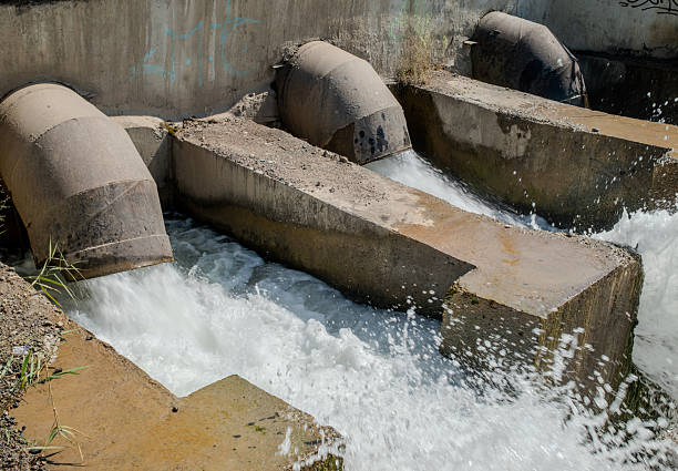 powerful water flowing out spillway dam