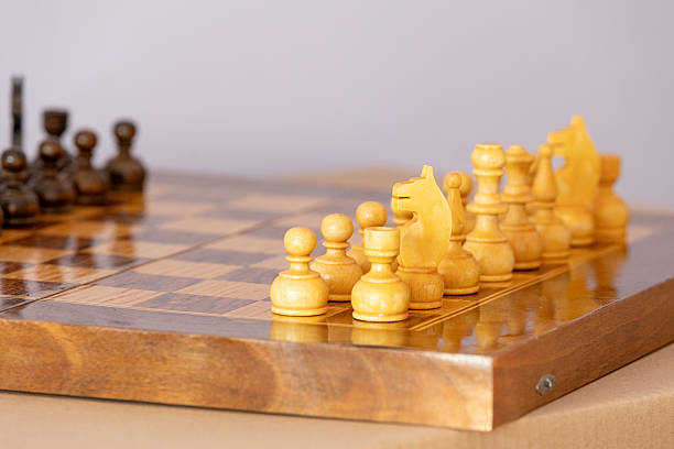 istock Wooden white chess pieces on the chessboard 2220687916
