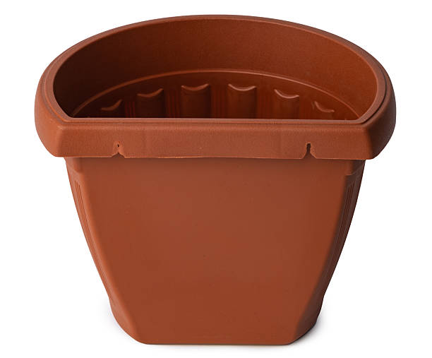 istock Brown plastic flower pot isolated on white 2220689379