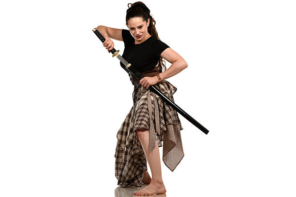 Formally dressed woman holding a kanata.