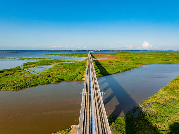 istock Railway bridge across green farmland 2220692344