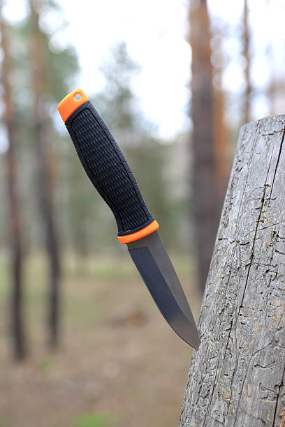 istock knife stuck in wood 2220692856