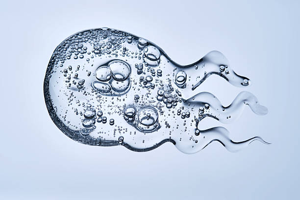 istock Delicious serum texture with bubbles on a blue background. 2220696686