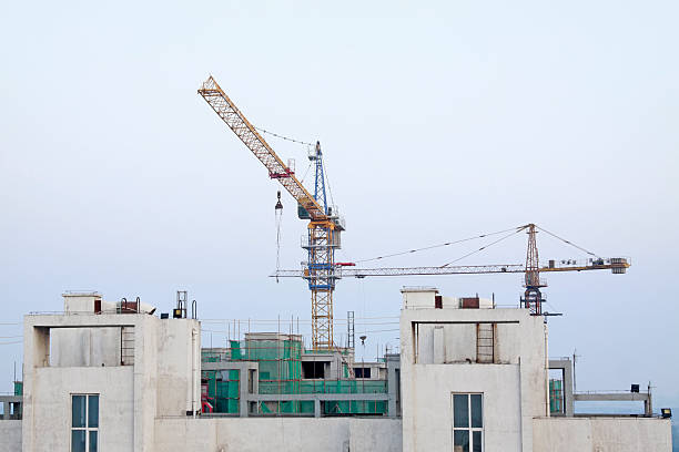 istock Buildings and tower crane 2220698275
